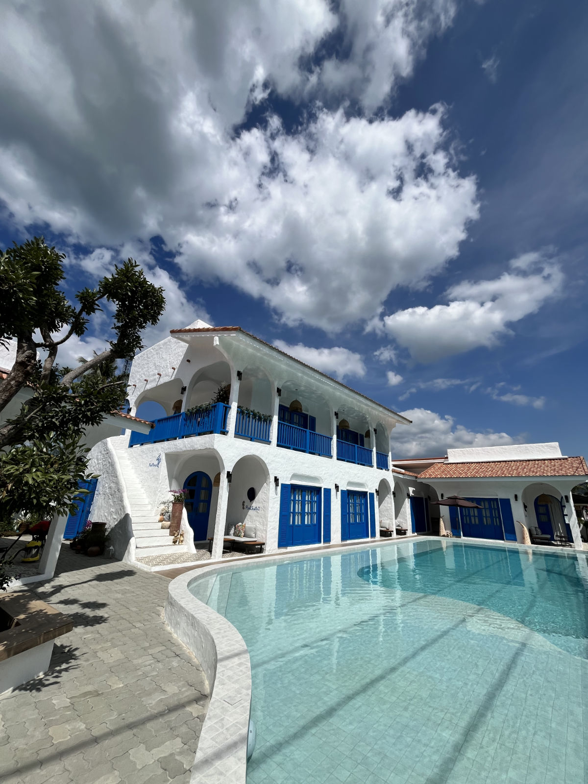 Whitewashed arches under a Khao Lak sky