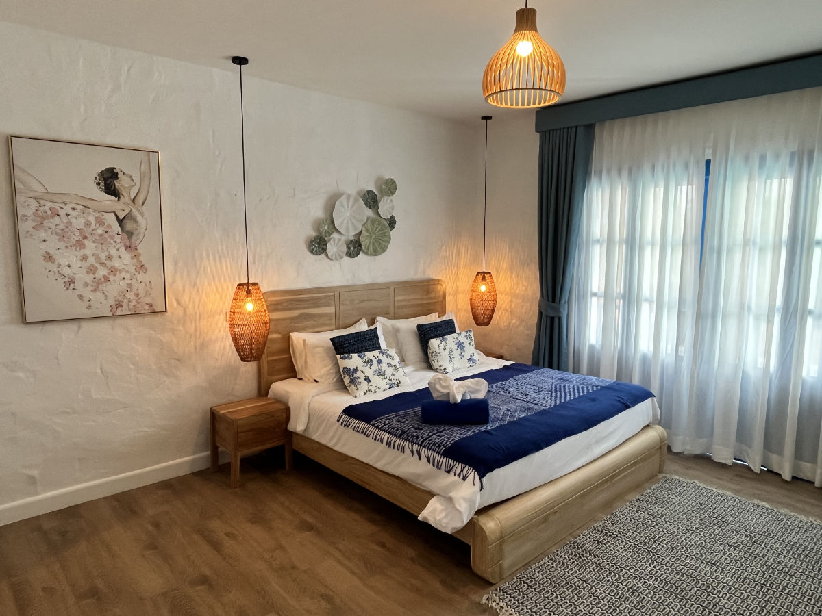 Penthouse bedroom with king-size bed