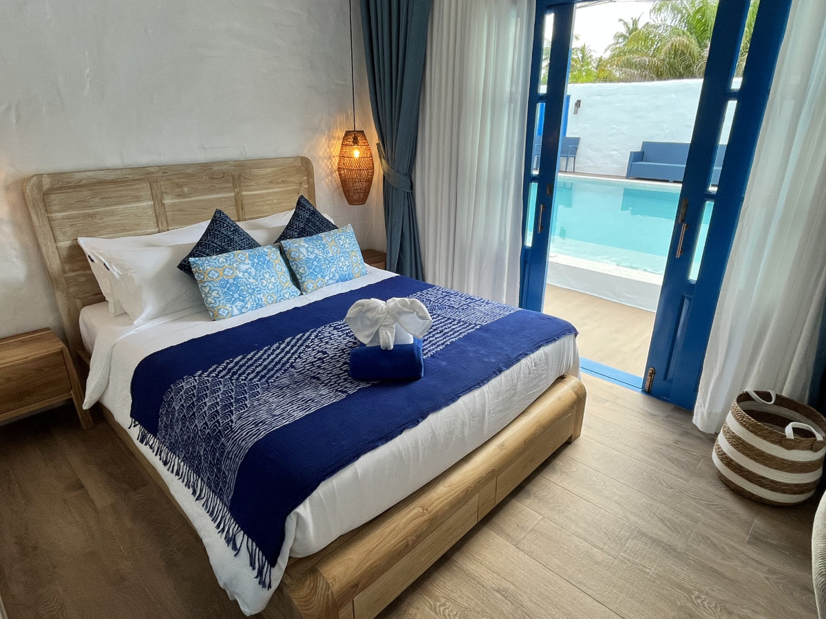Pool Suite bedroom, doors open to the pool