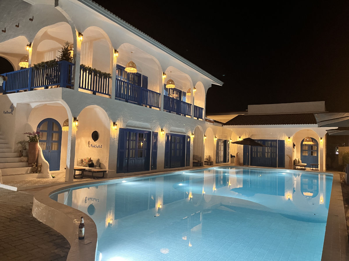 The pool and main building at night