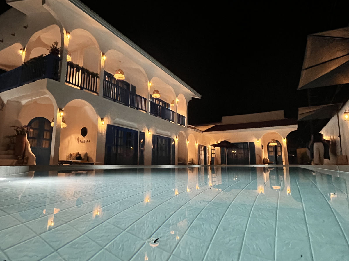 The pool and main building at night